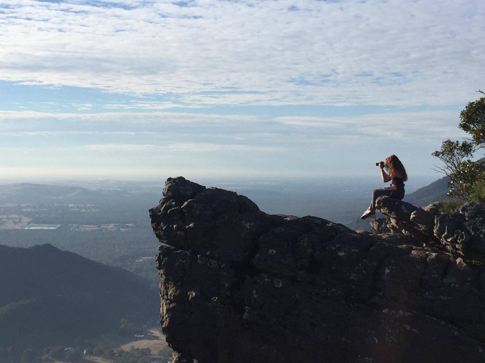 student on a cliff